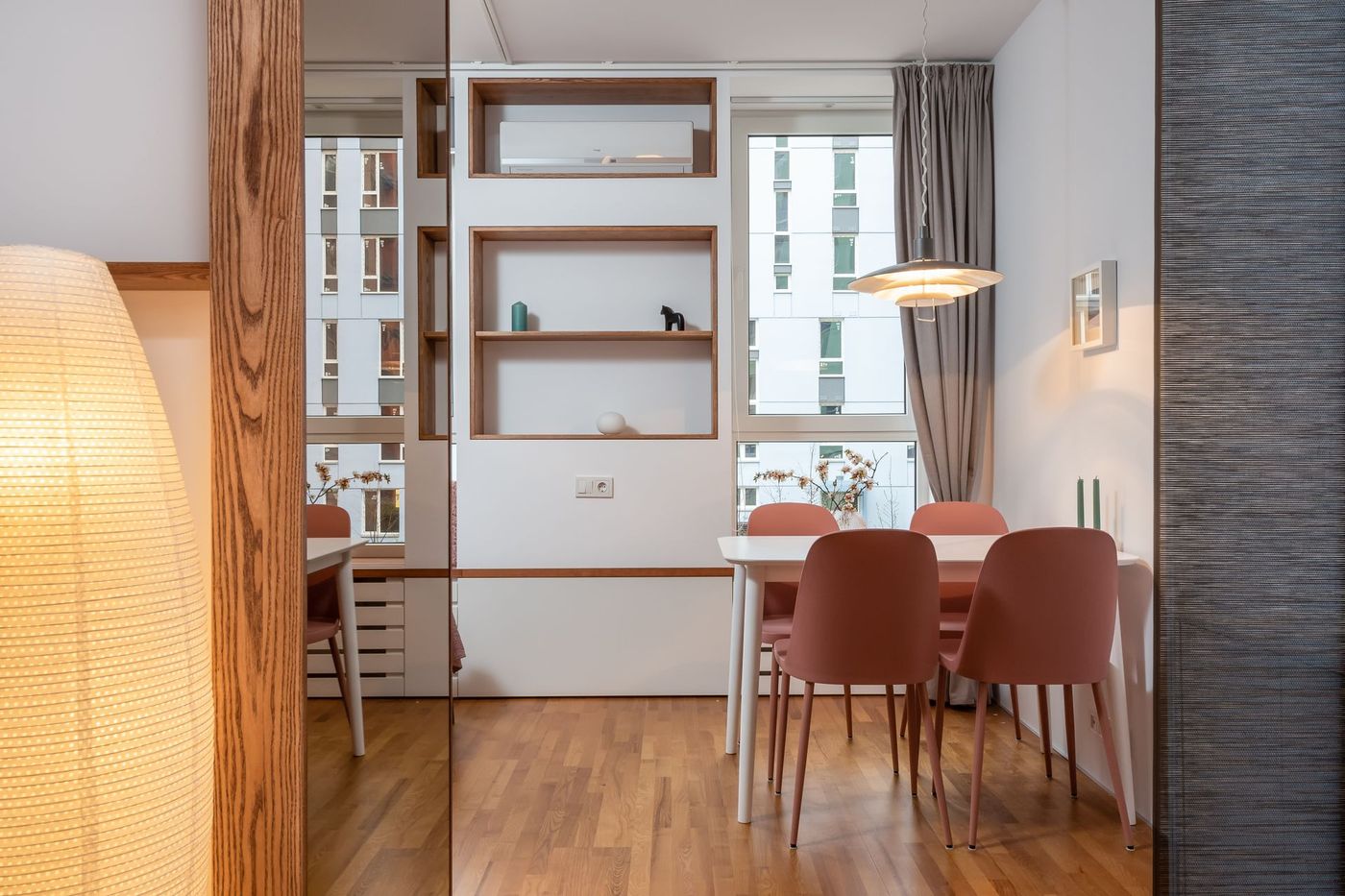 A tidy living and dining area with wood floors
